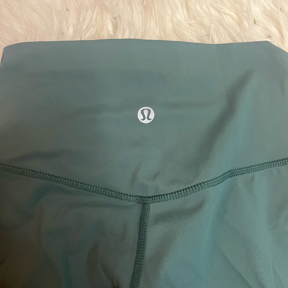 teal ish lulu leggings, size 4